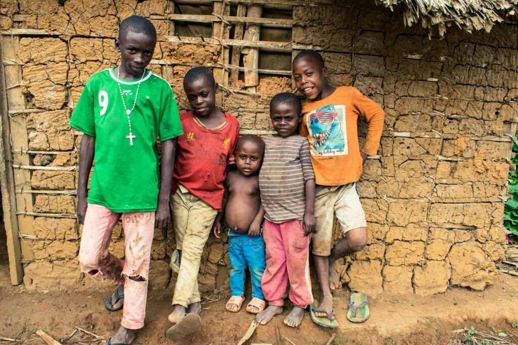 Five children stand together in a rural village in Mintom, Cameroon.